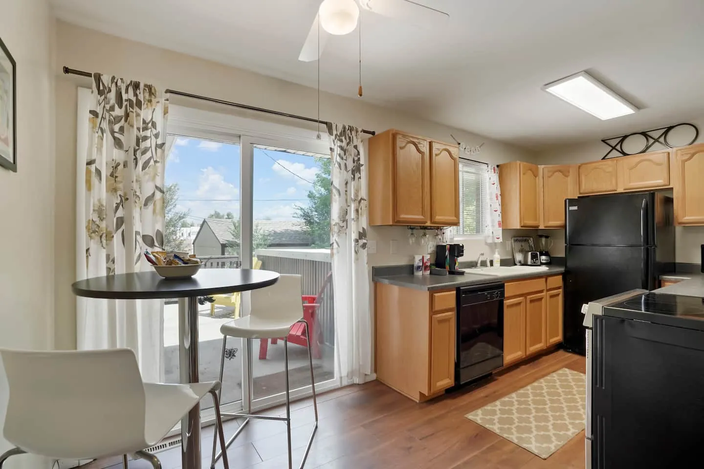Updated kitchen with full-size appliances and a bistro table