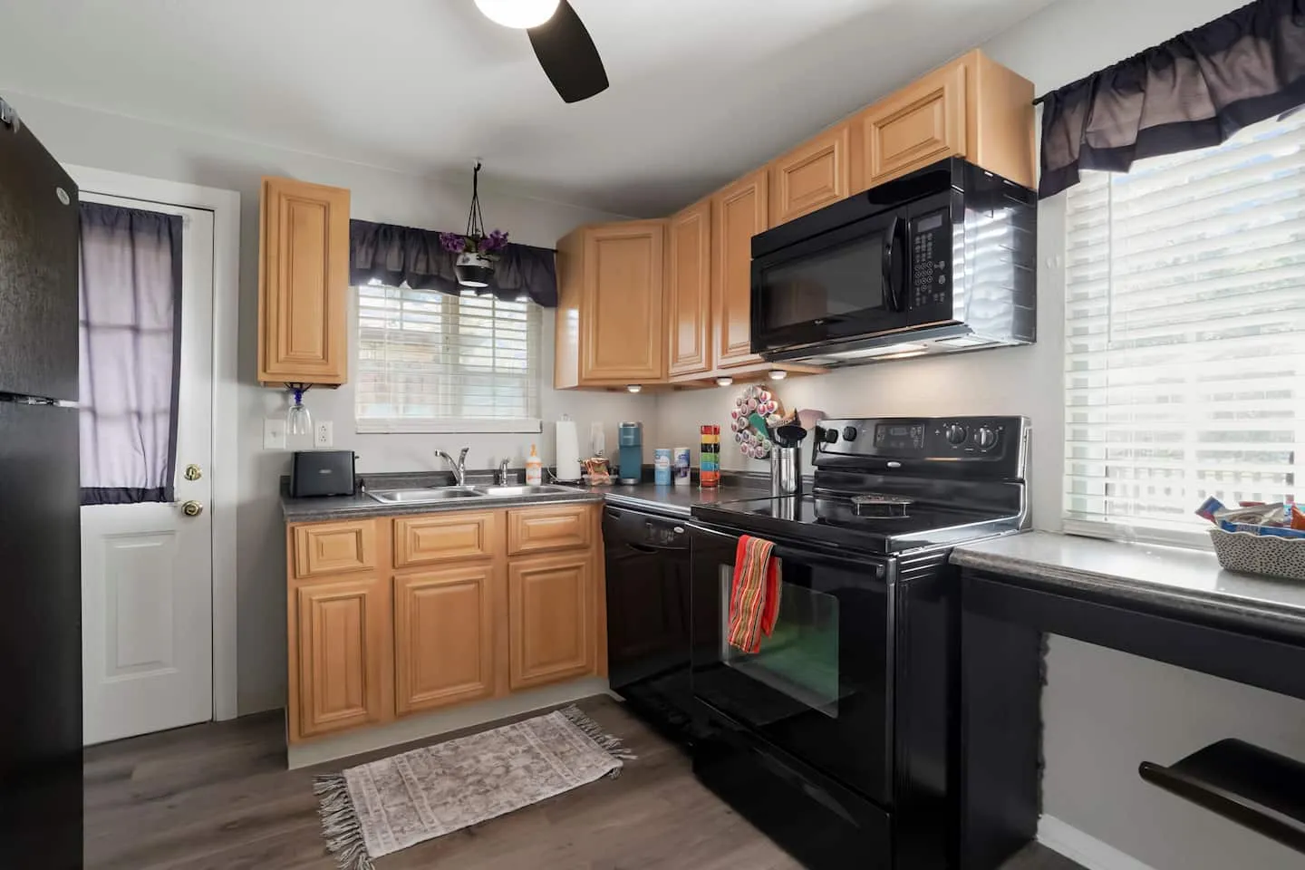 Full kitchen with full-size stove, oven, microwave, and fridge