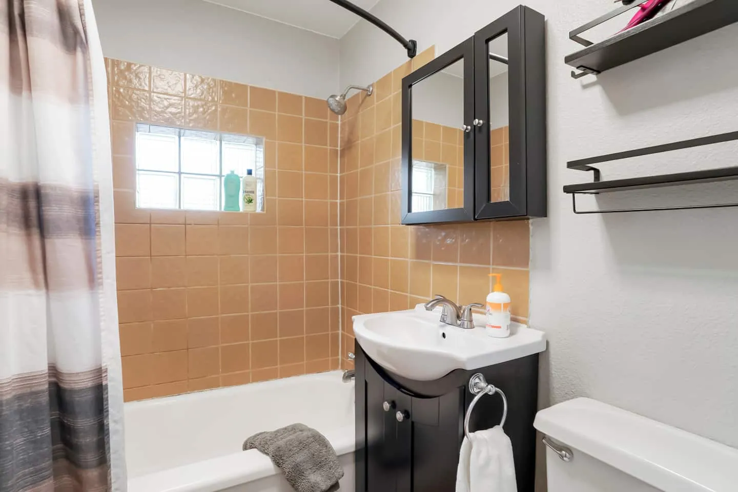 Full bathroom with tub and shower