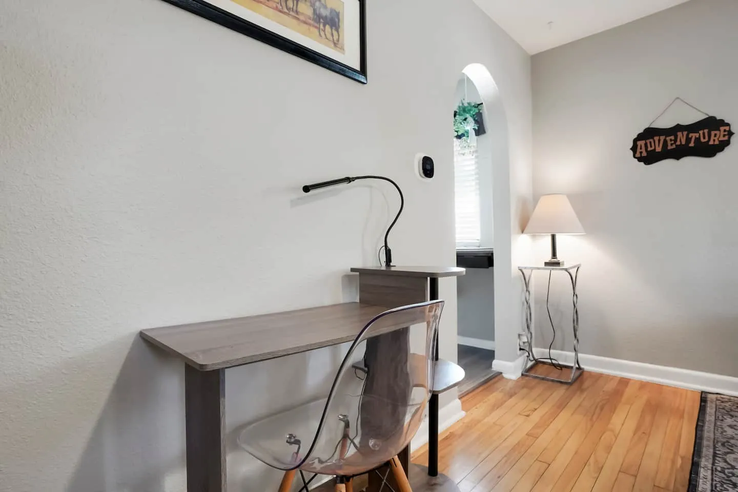 Dedicated desk with a task lamp, set up for remote work