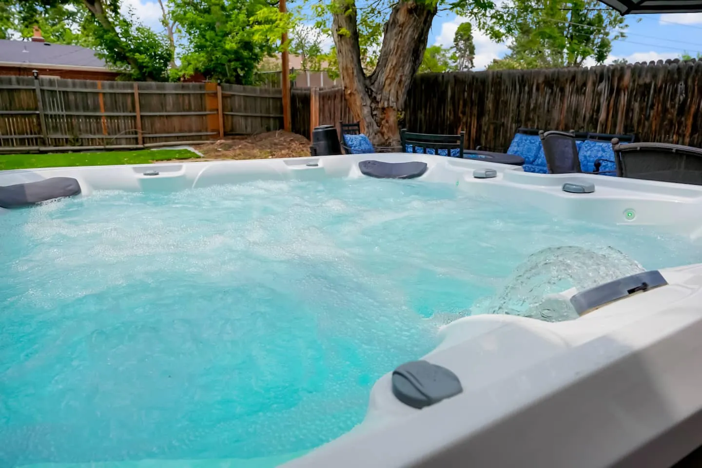 Private hot tub in the fenced backyard